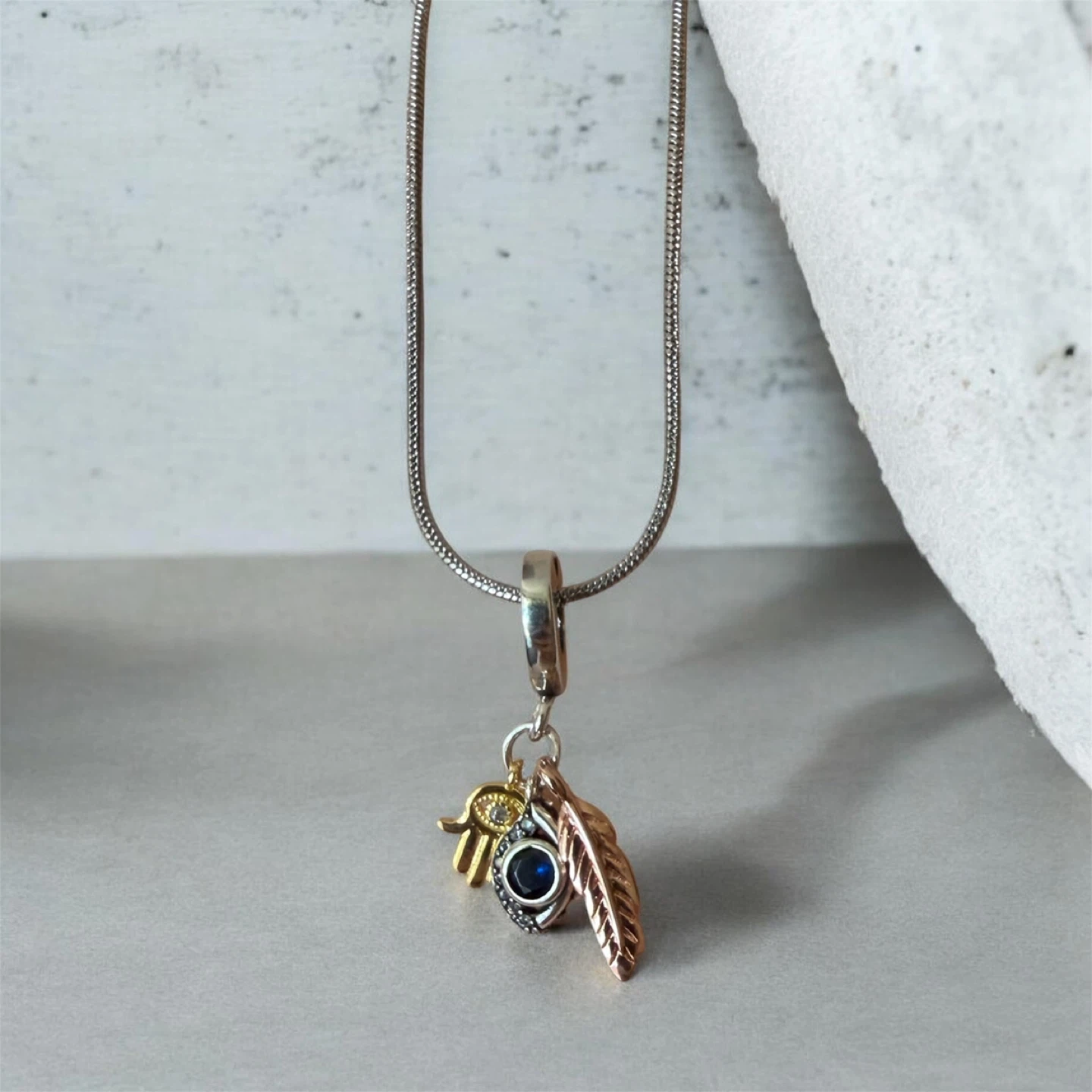 Hamsa Hand and Feather Charm with Blue Stone