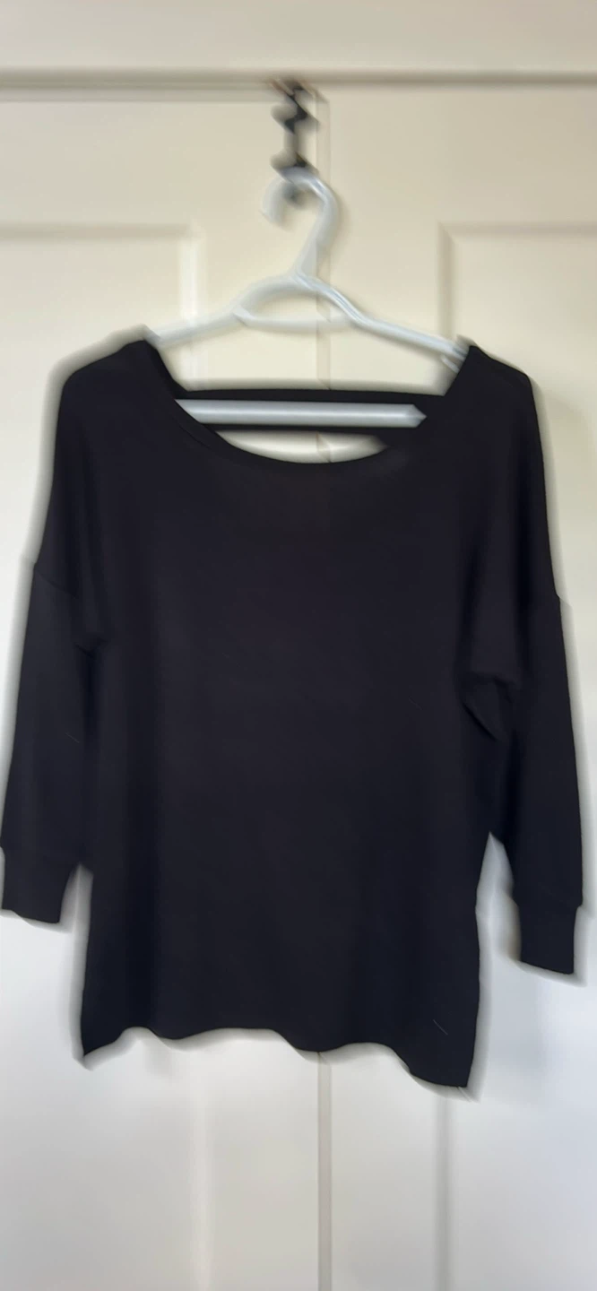 Black long sleeve sweater with back cutout