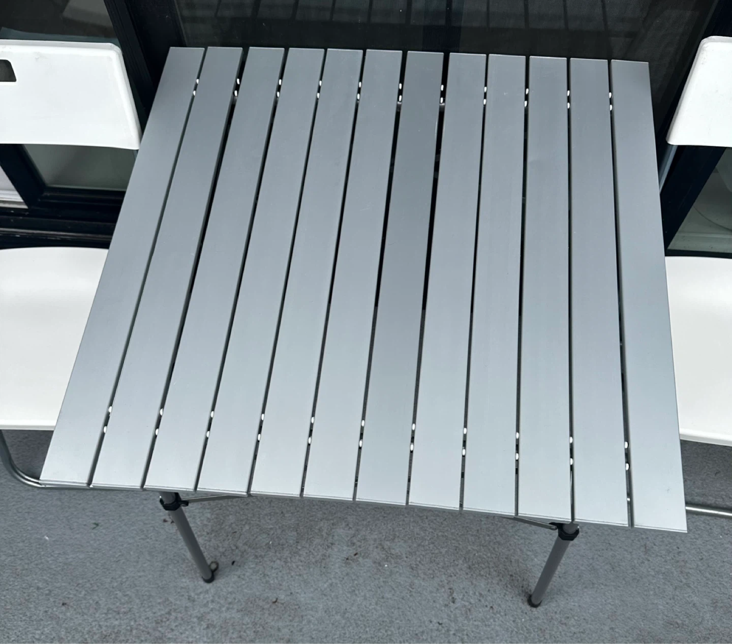 1 Folding table with 2White Folding Chairs