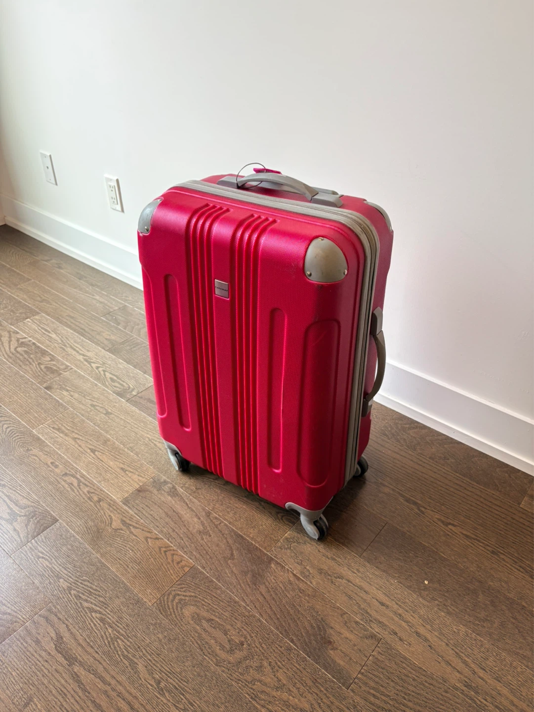 26” pink American Tourister Spinner Luggage