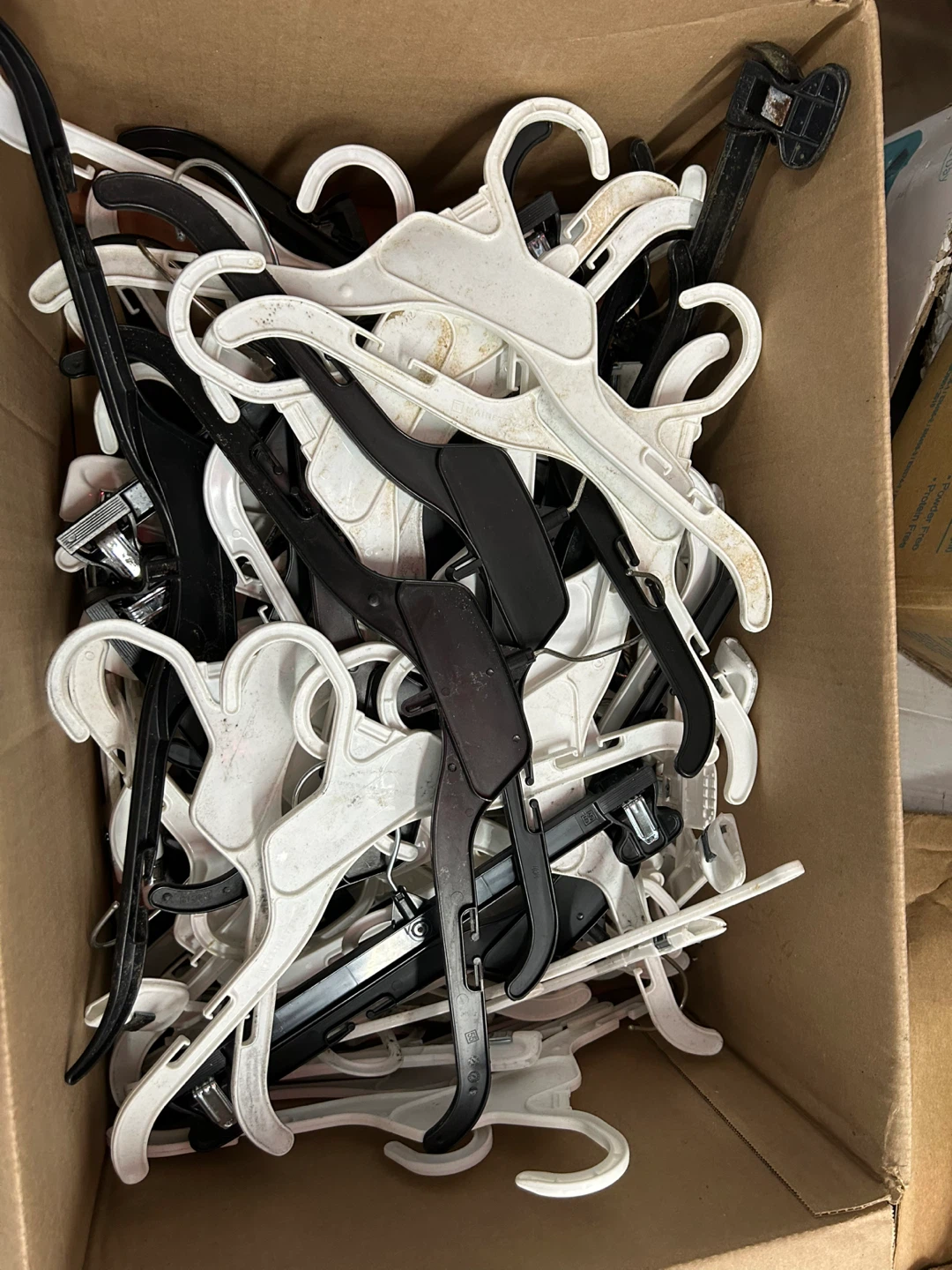 Lot of Black and White Clothes Hangers