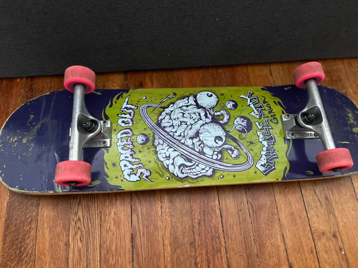 Skateboard with Brain and Eye Graphic
