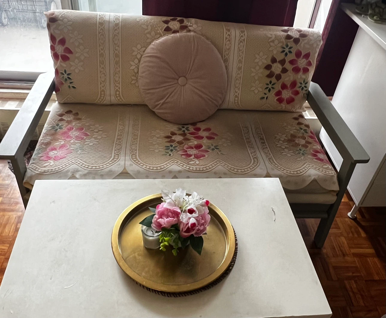 Sofa with Floral Slipcover and a white tea table - photo 2