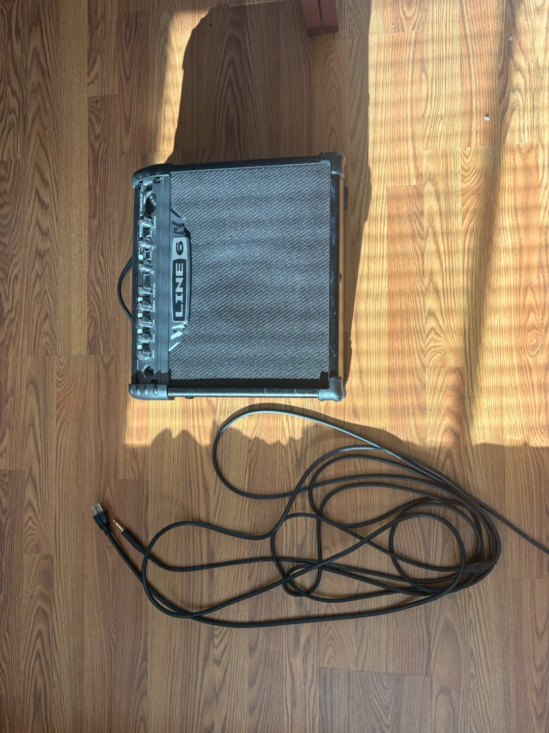 Squier Stratocaster Electric Guitar and Line 6 Amp