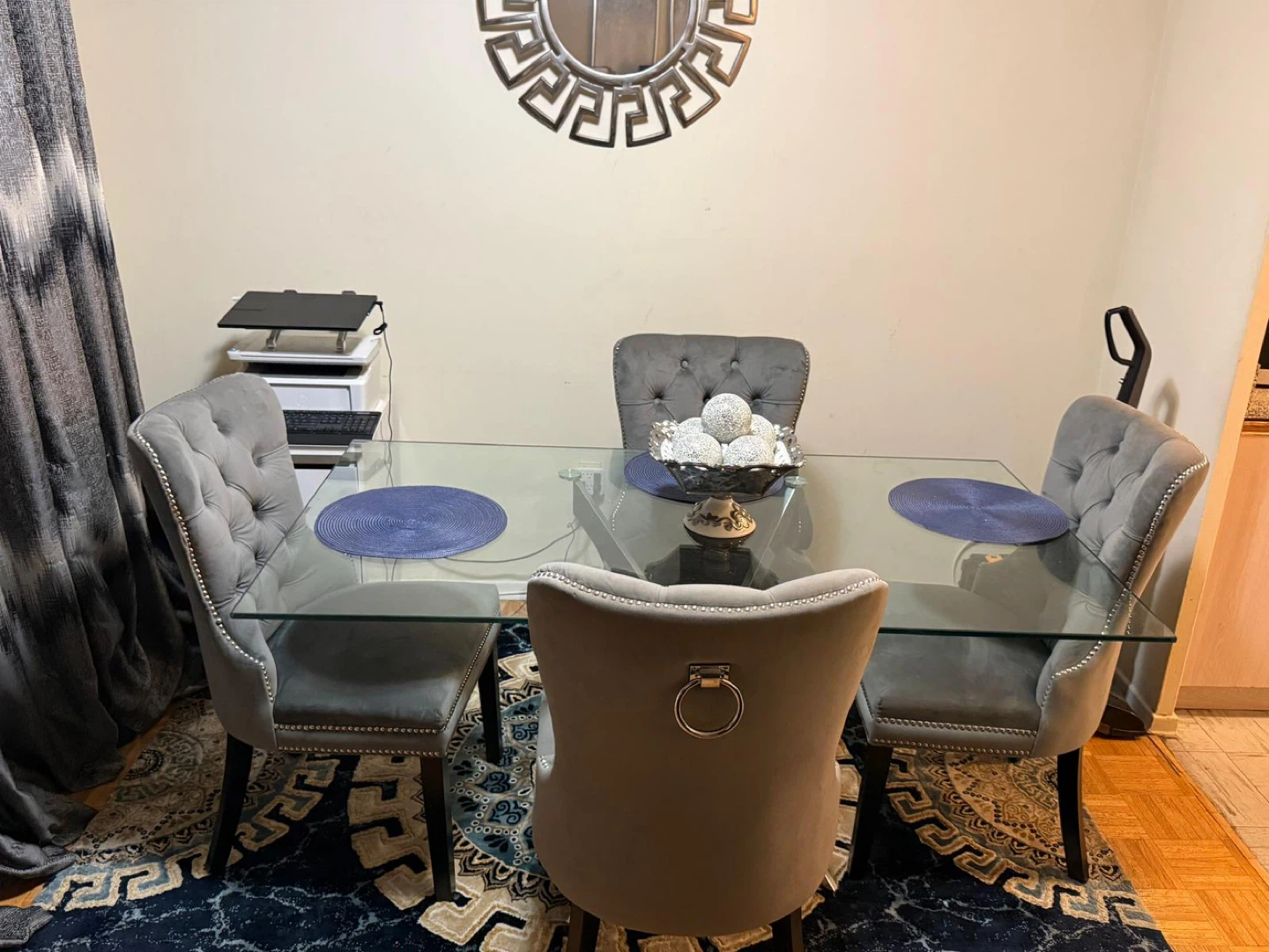 Glass dining room table with four chairs