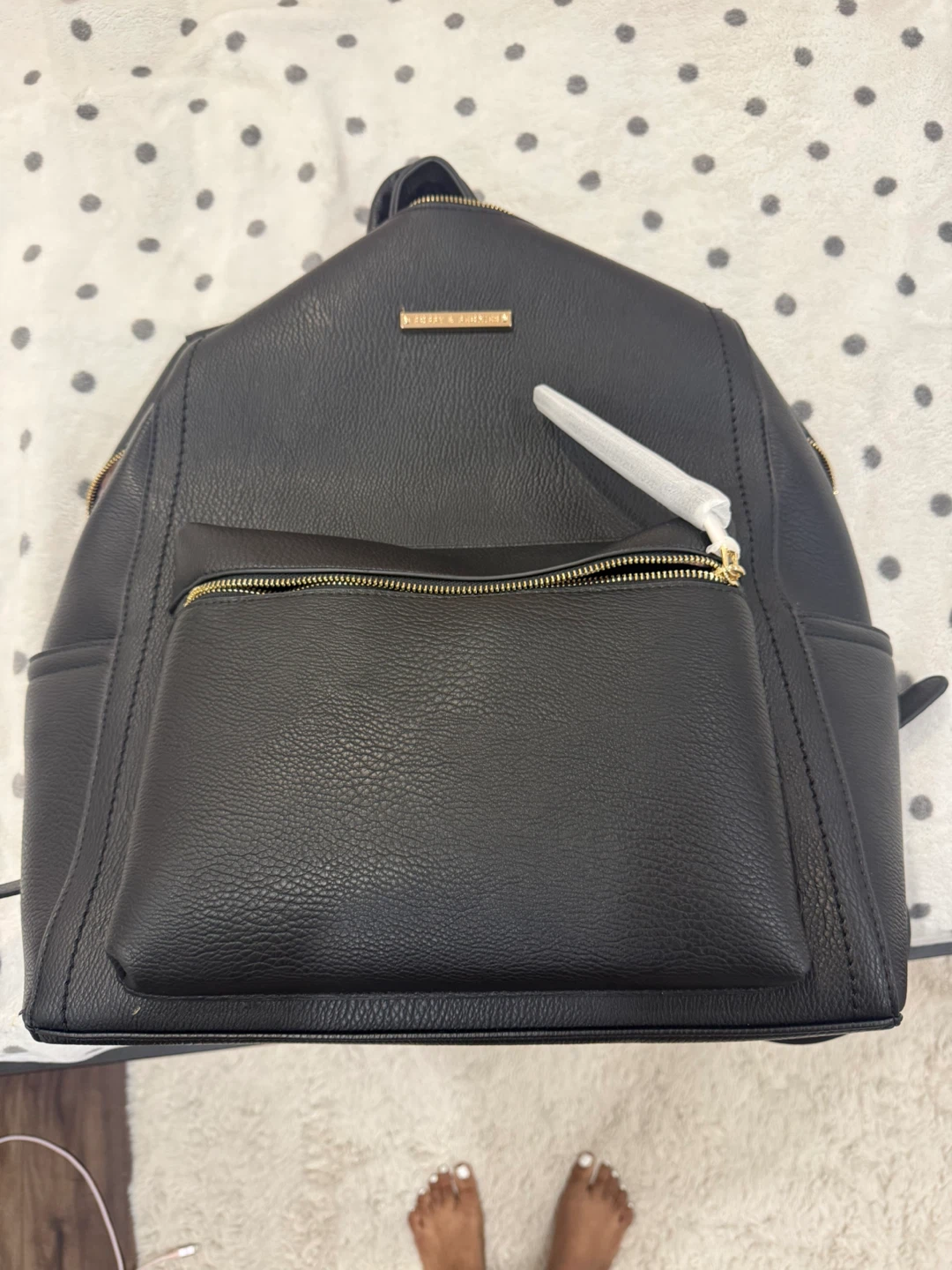 black faux leather backpack