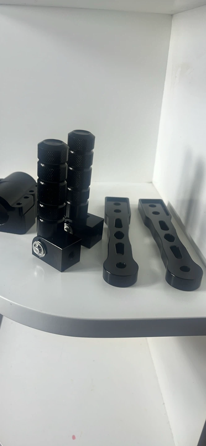 Black Motorcycle Foot Peg Mounts and Handlebar Grips