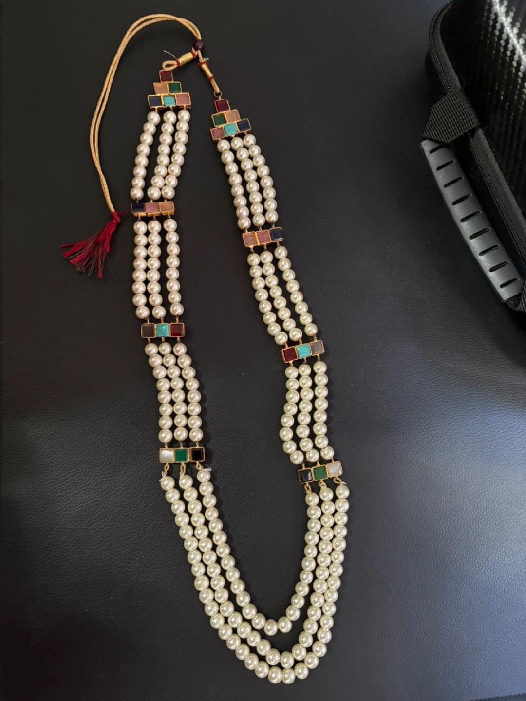 Multi-strand pearl necklace with coloured beads