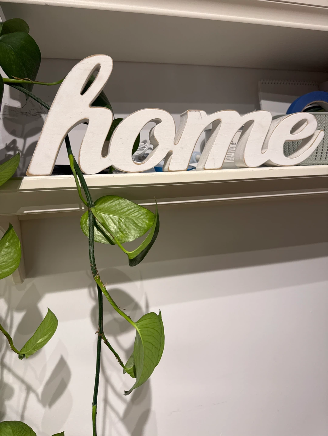White "home" wooden sign