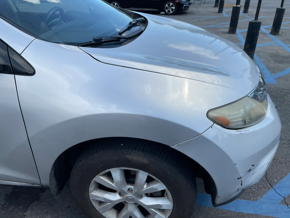 Silver Nissan SUV - photo 5