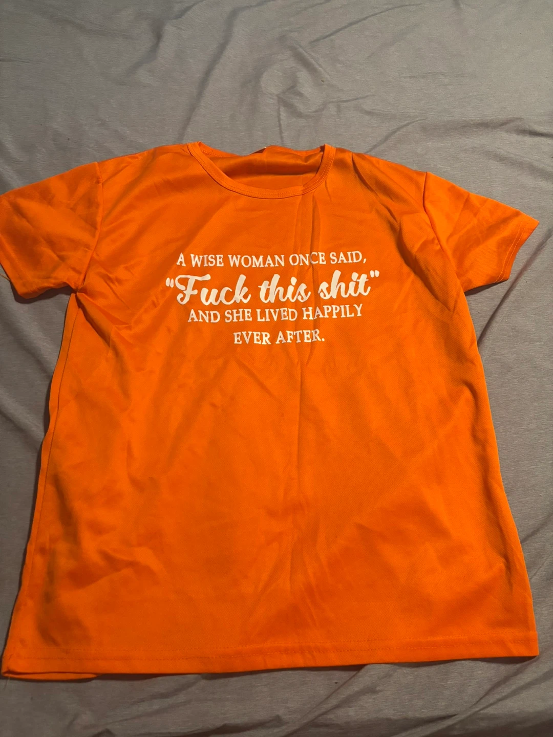 Orange T-shirt with "Fuck this shit" graphic
