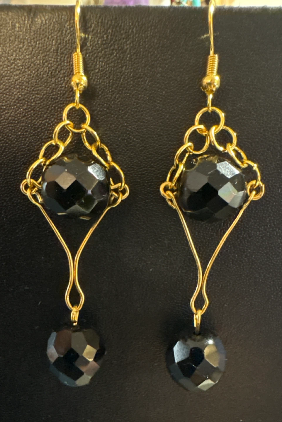Gold Tone Dangle Earrings with Black Faceted Beads