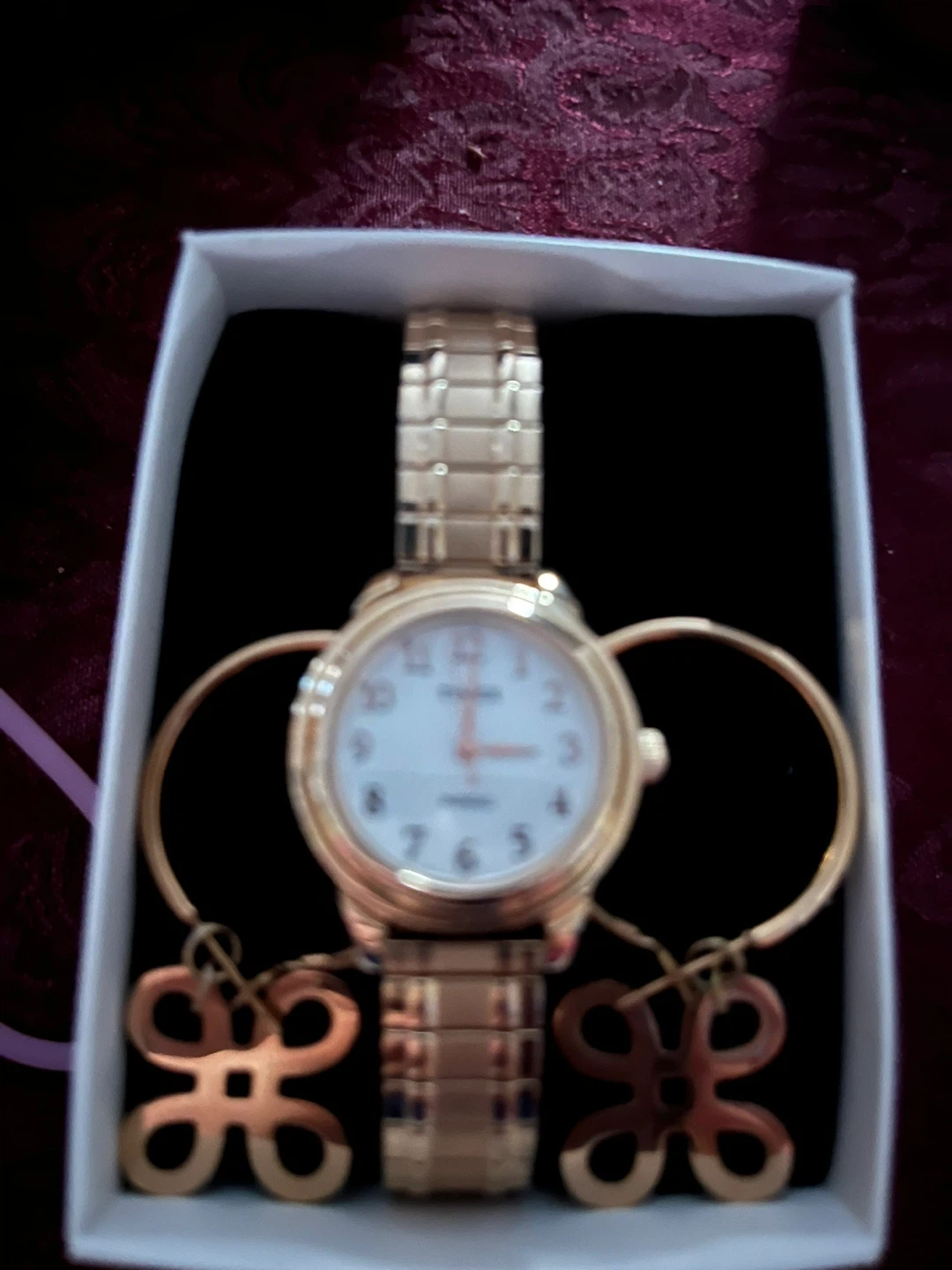 Gold tone watch with matching bracelets