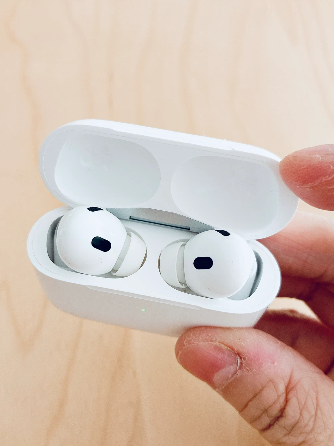A pair of bluetooth earbuds with charging case