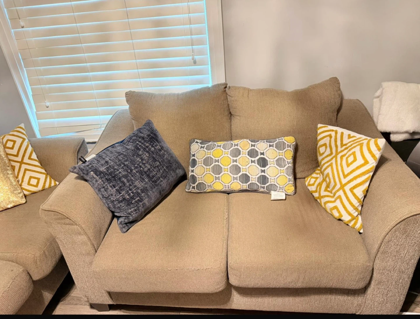 Tan Couch with Decorative Pillows