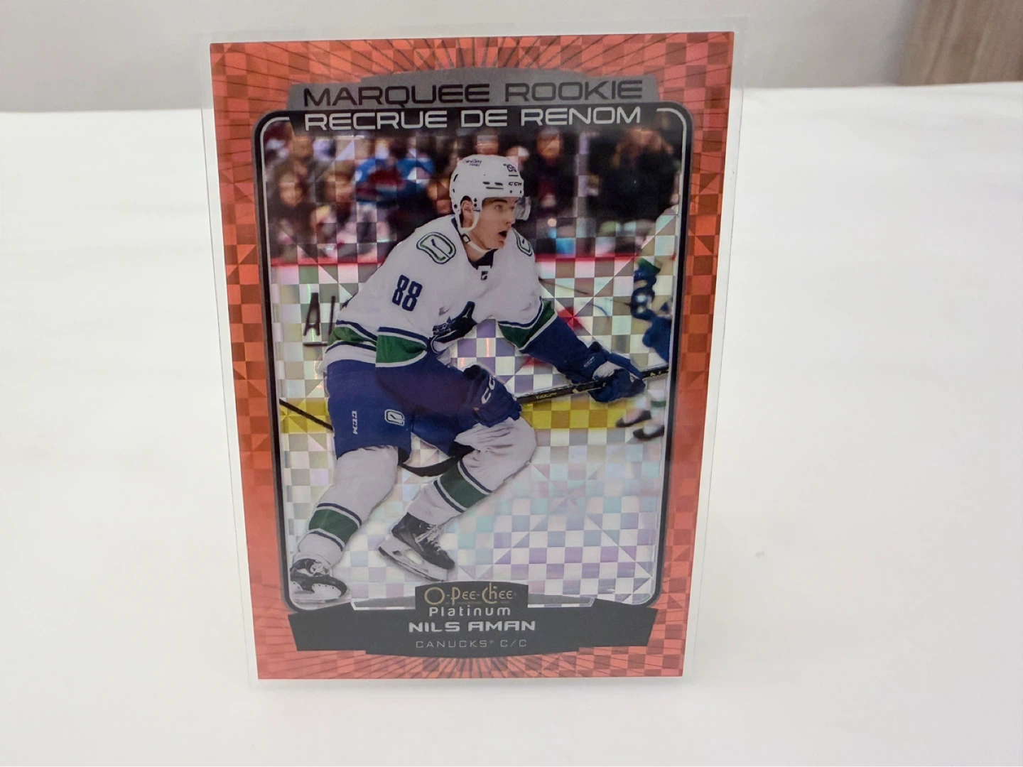 22-23 O-Pee-Chee Rookie Canucks NILS AMAN Orange Checkers /25