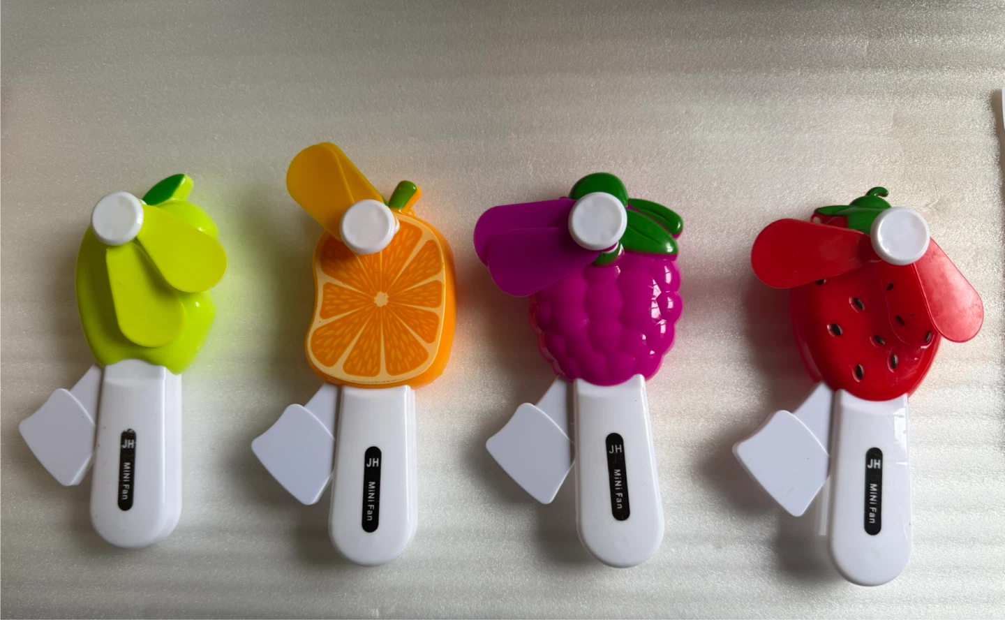 Manual powered handheld fans