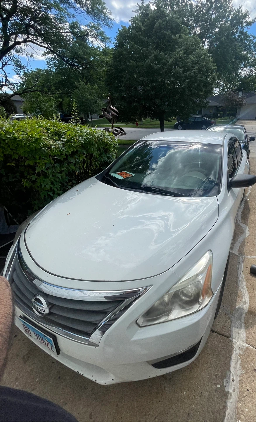 White Nissan Altima Sedan
