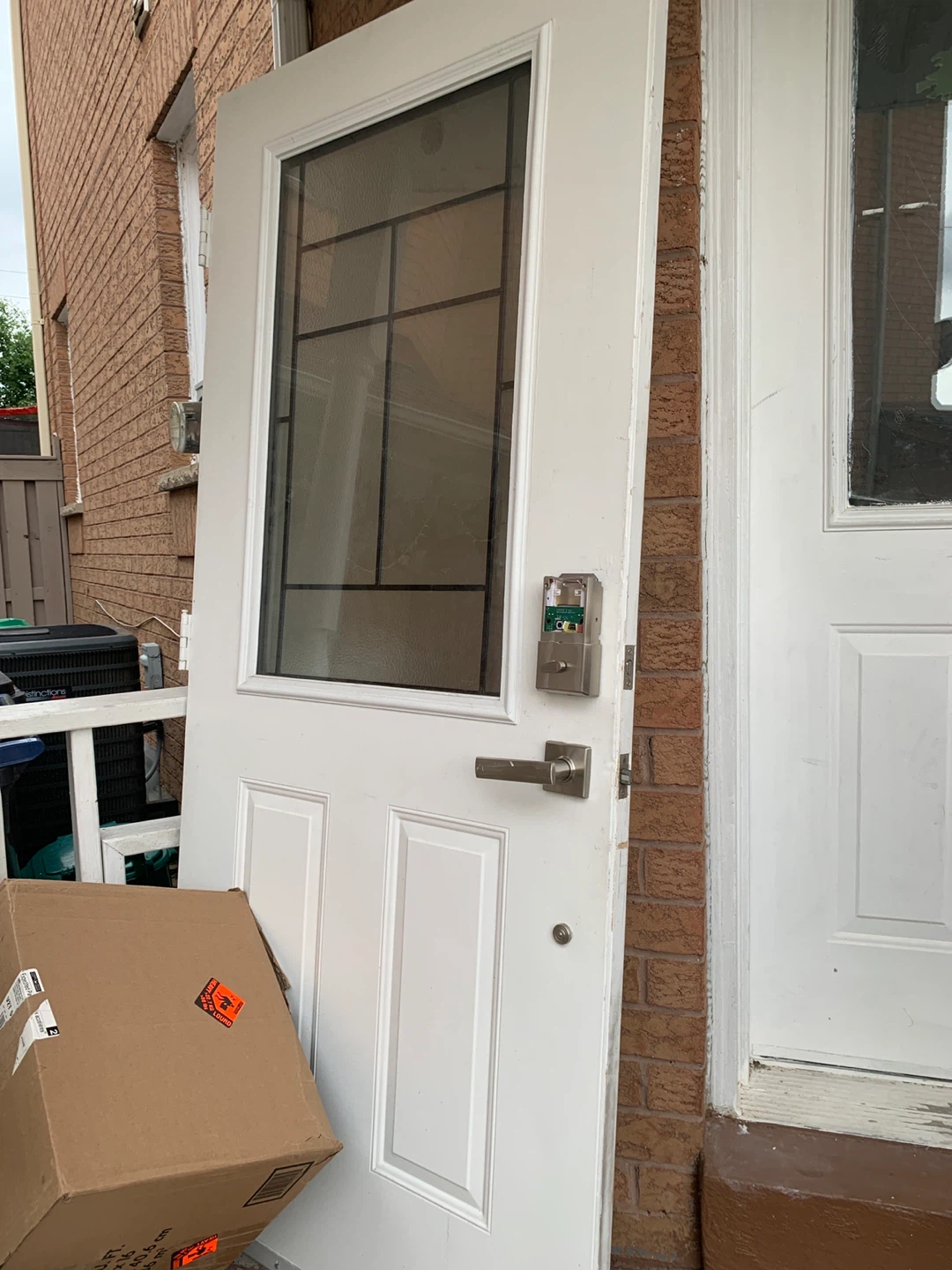 White Exterior Door with Window and Smart Lock