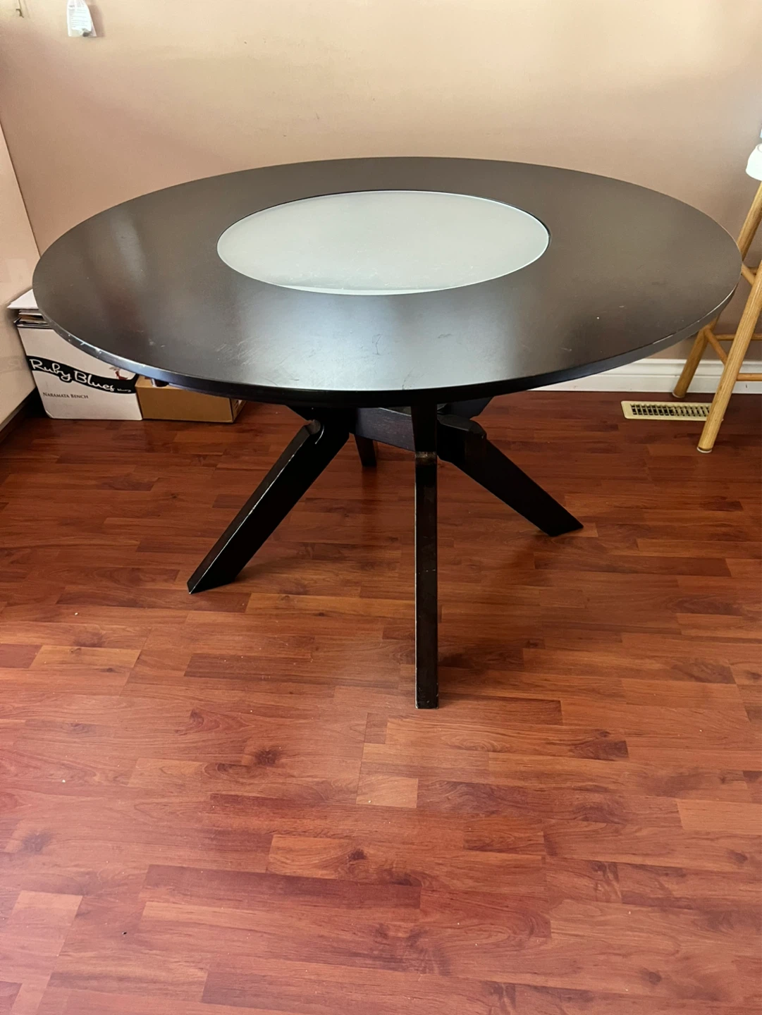 Dark Round Dining Table with Central Frosted Glass Accent