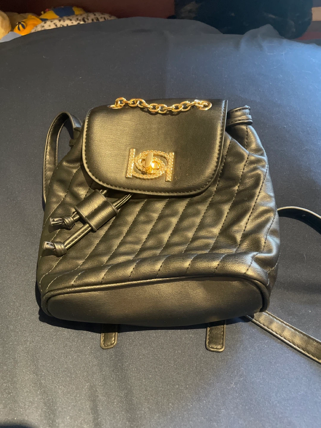 BEBE Black Quilted Backpack Purse with Gold Chain Detail