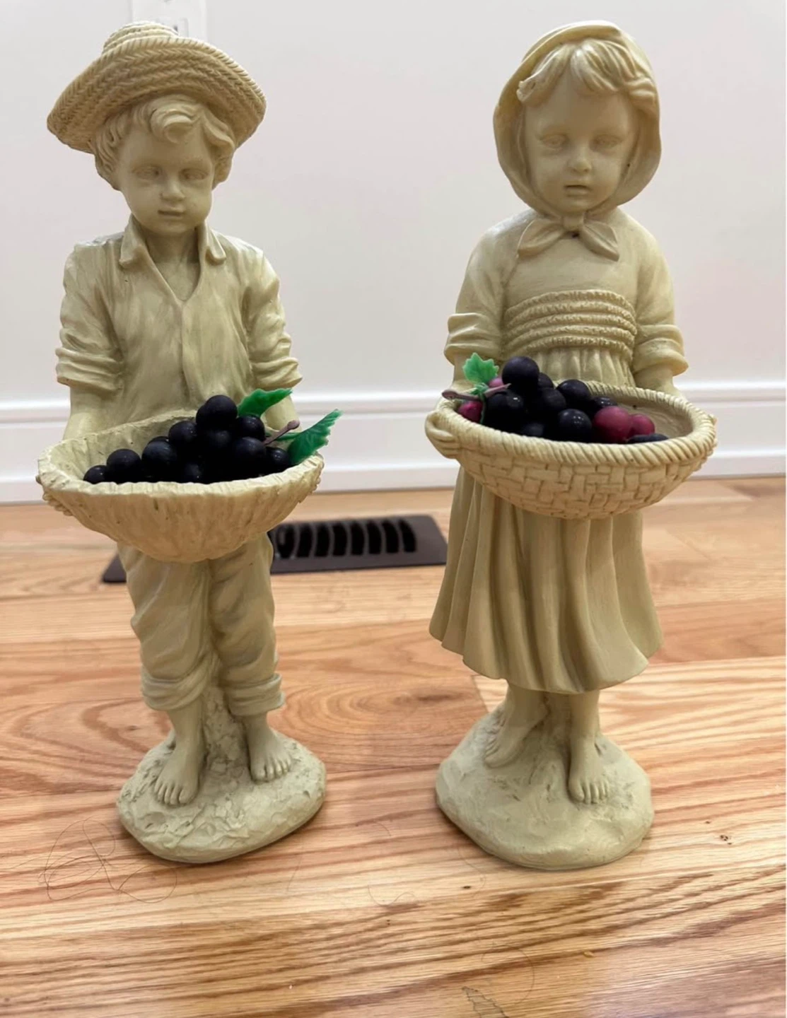Set of 2 vintage boy and girl statues with fruit baskets
