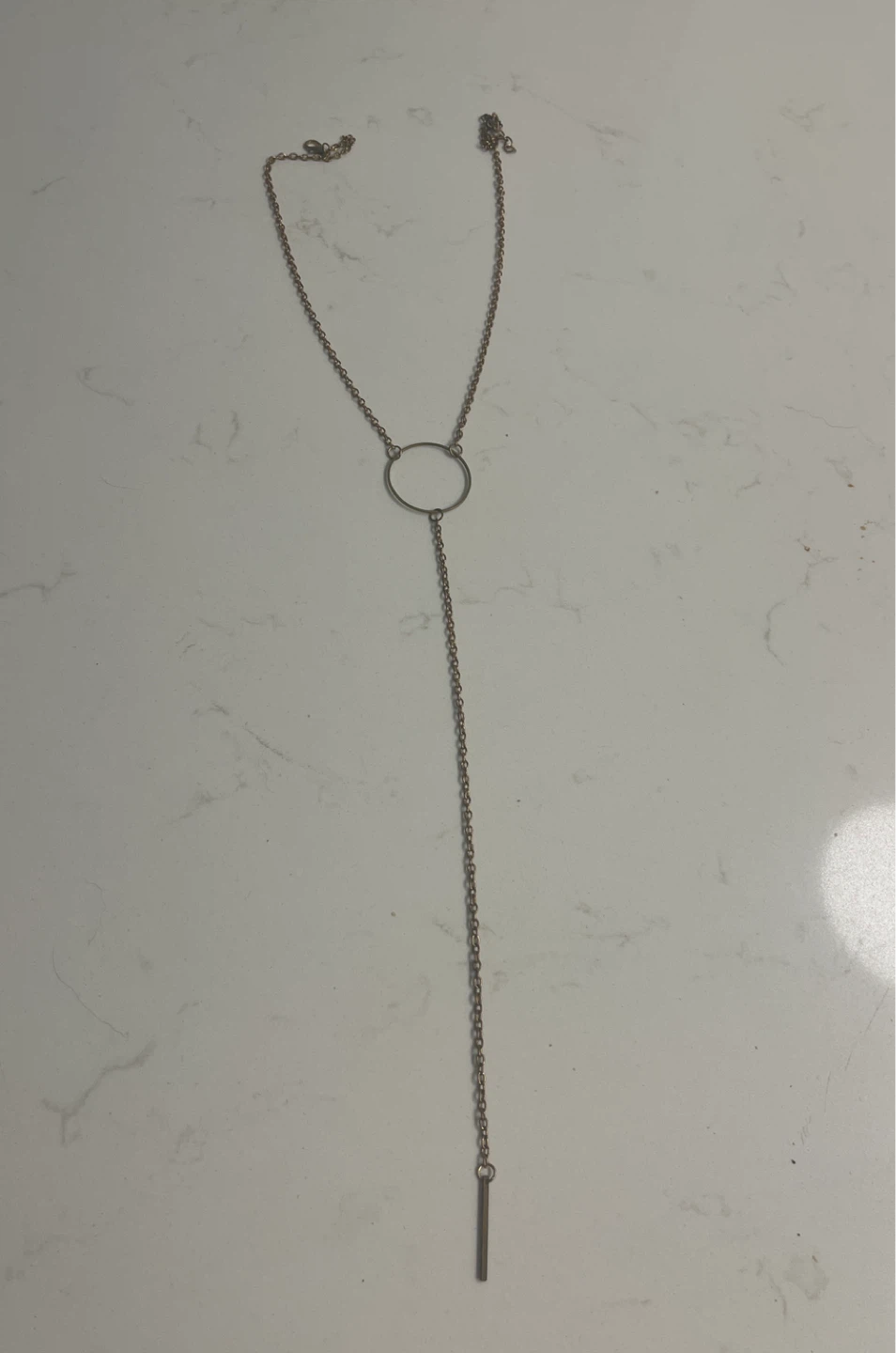 Gold tone Y-drop lariat necklace with circle and bar pendant