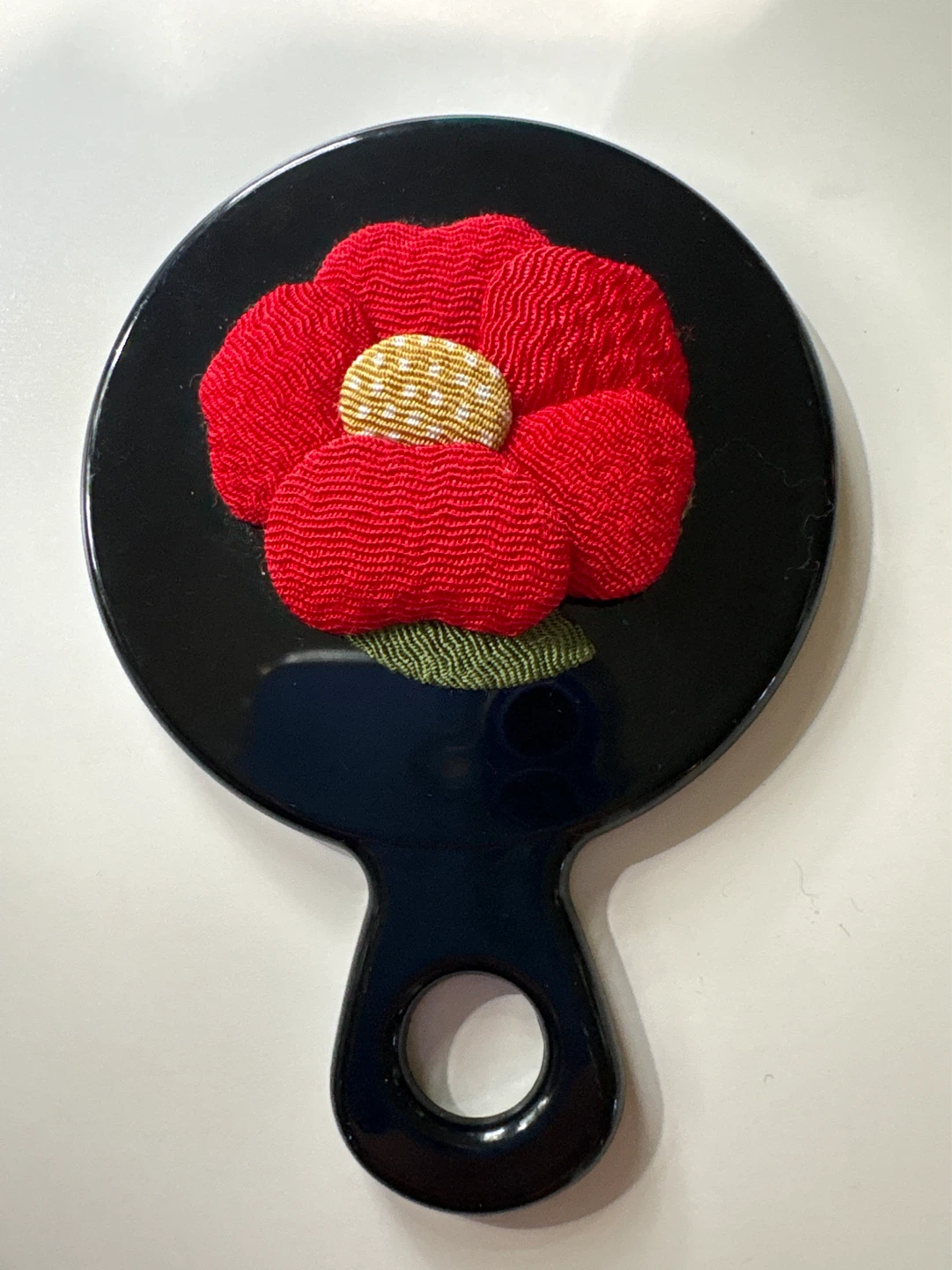 Black Handheld Mirror with Red Floral Design