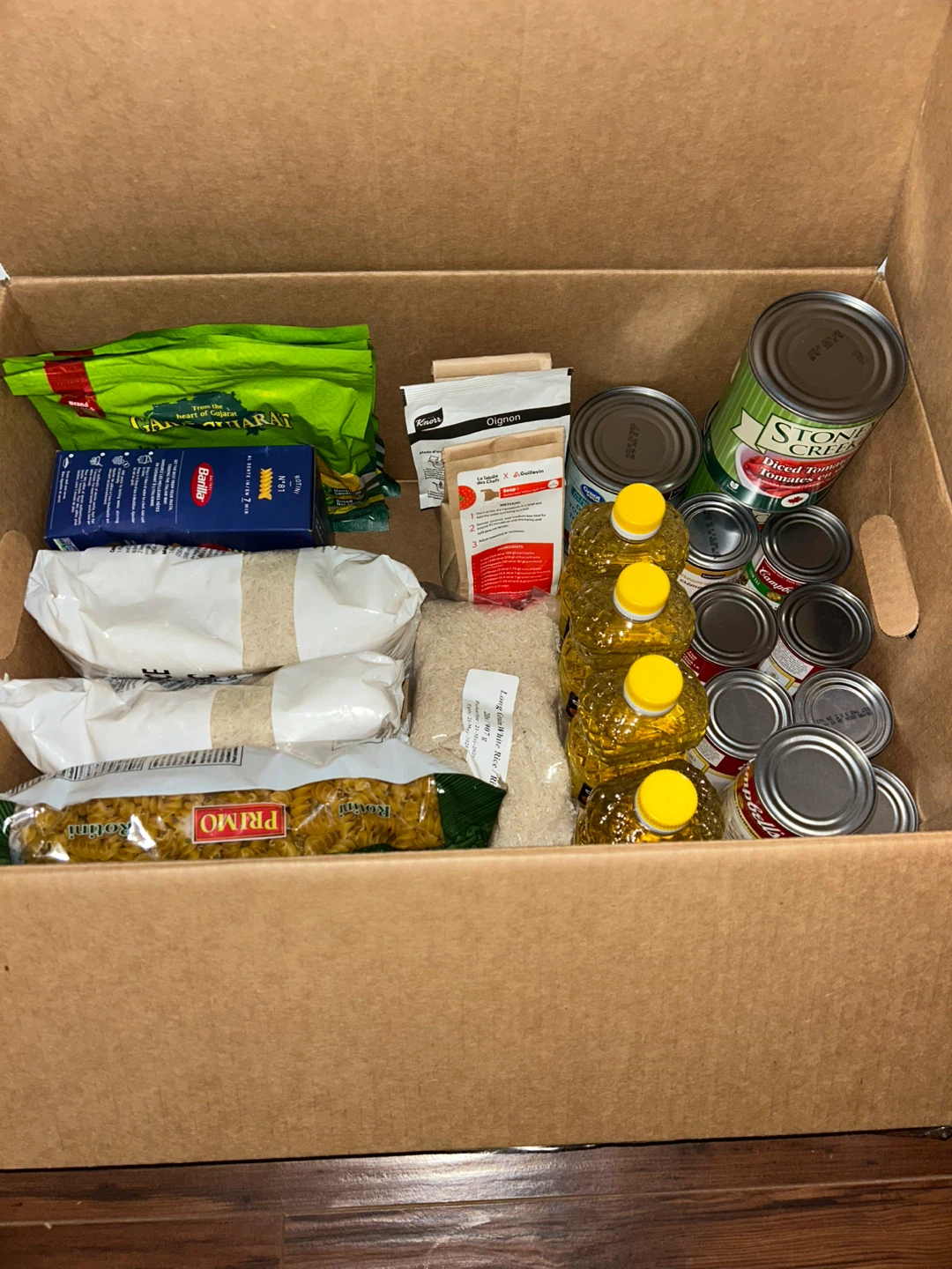 Assorted Grocery Items - Pasta, Rice, Soup, Oil, and Snacks