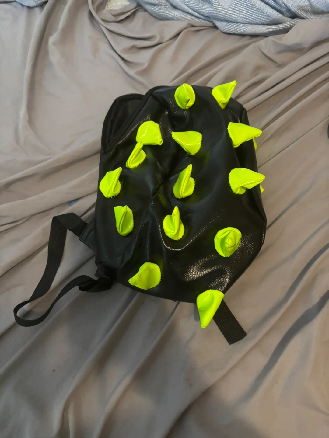 Black backpack with neon green spikes