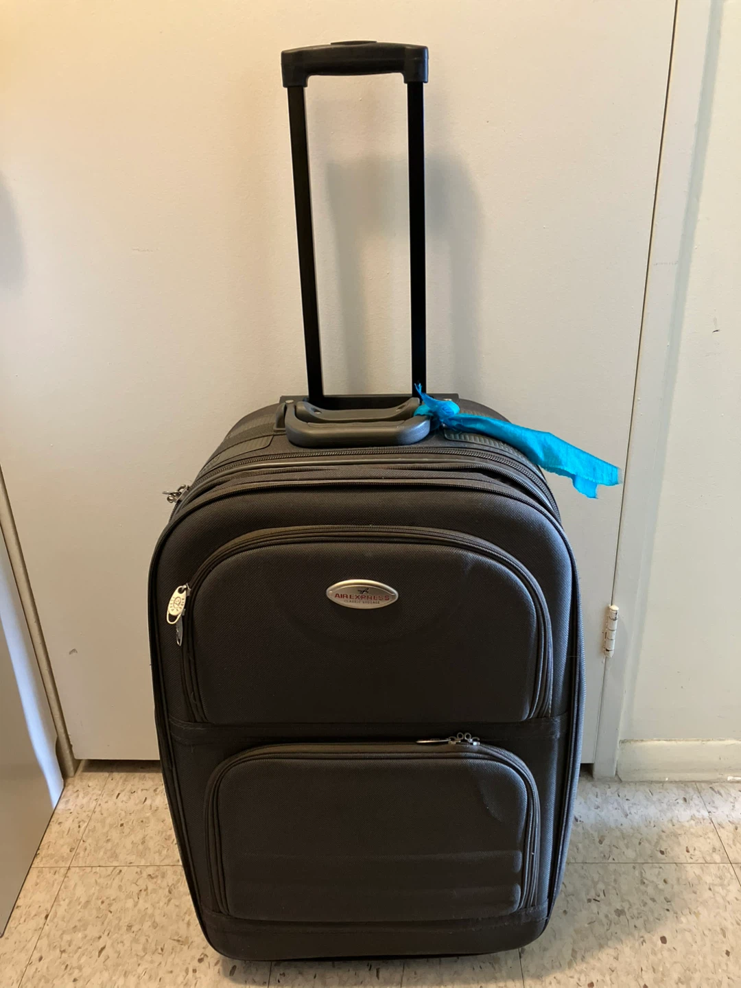 American Tourister Black Rolling Suitcase