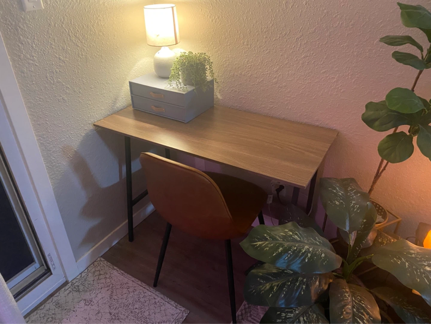 Wooden desk with black legs and chair