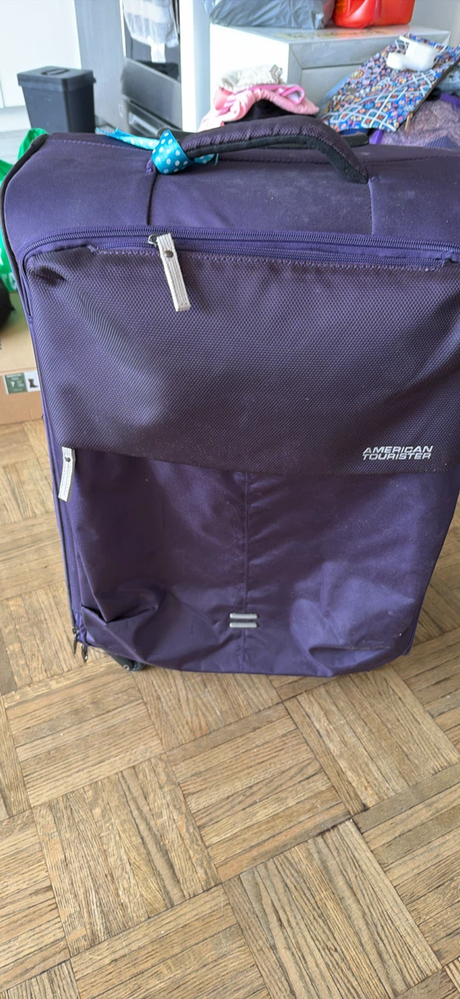 American Tourister Purple Suitcase