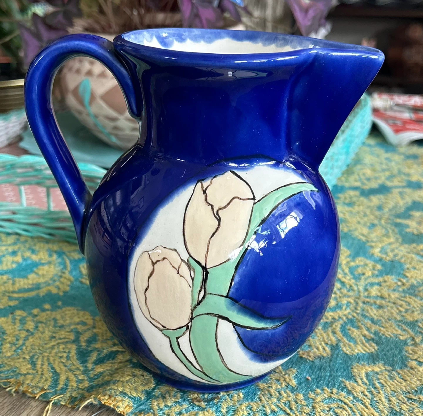 Blue ceramic pitcher with floral design ⚽