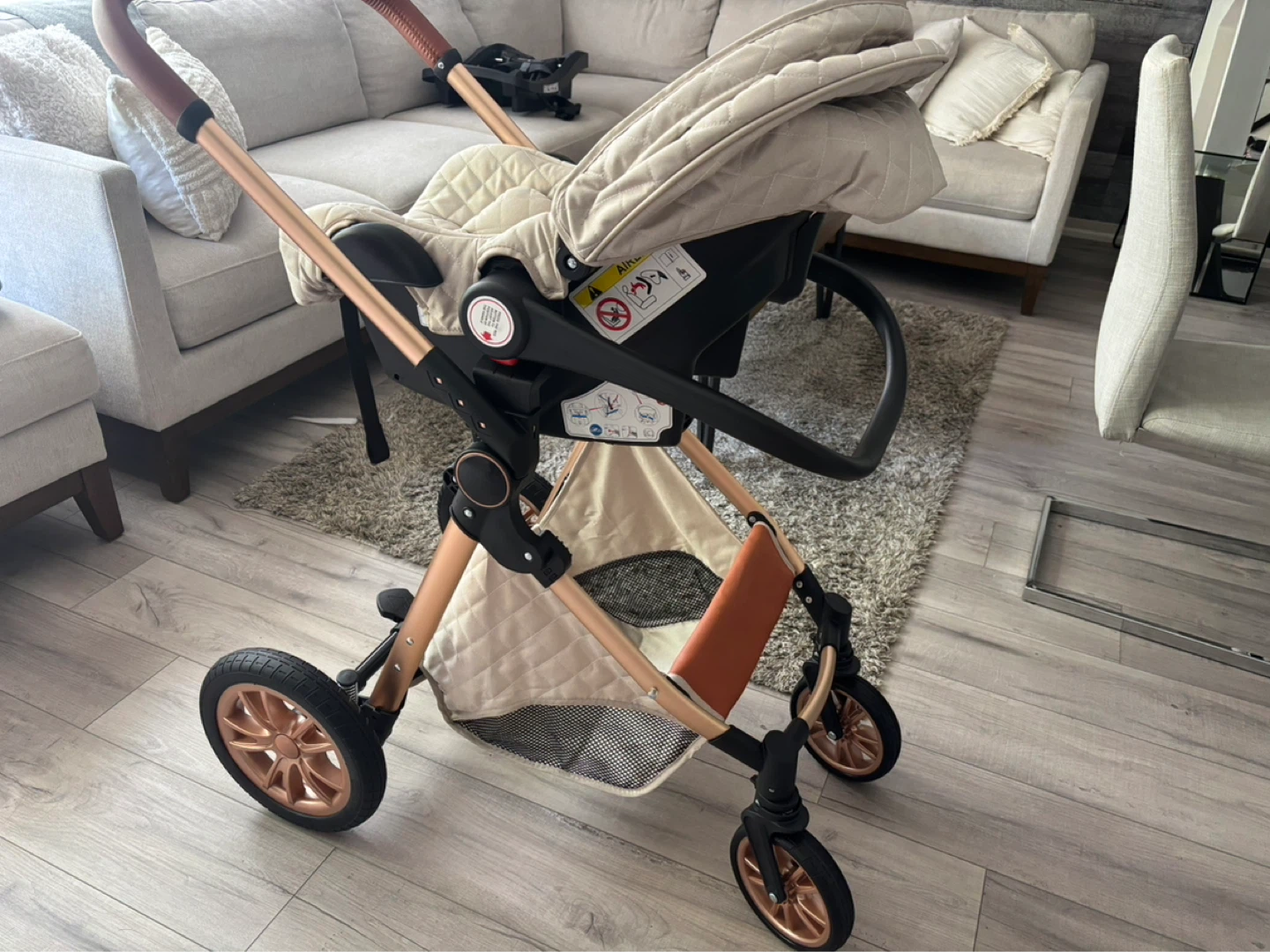 Cream Quilted Stroller with Tan Handlebars