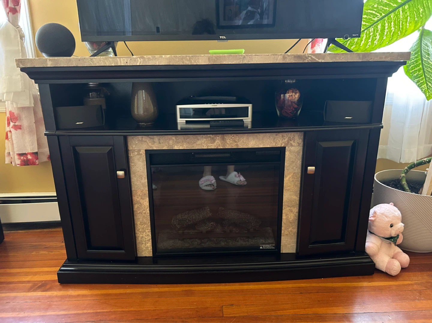 Marble look entertainment console with fireplace