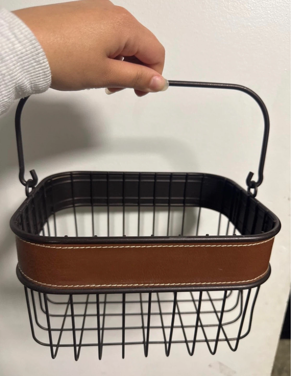 Wire basket with handle and faux leather trim