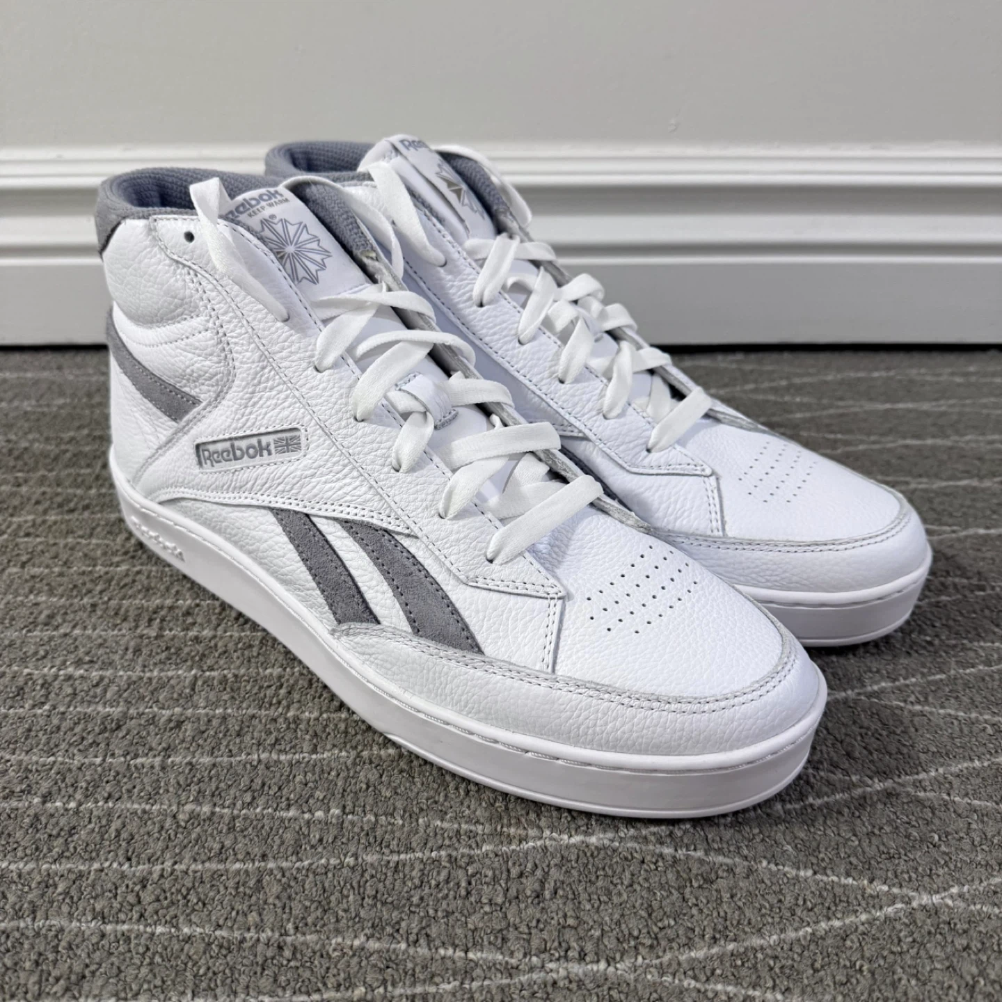 Men’s new Reebok white hightop sneakers