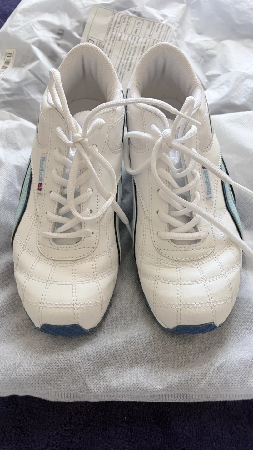 Reebok white sneakers with blue and light blue accents
