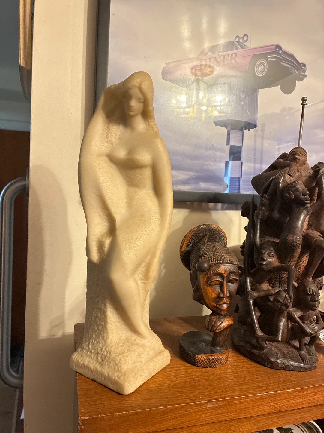 Cream colored female form sculpture