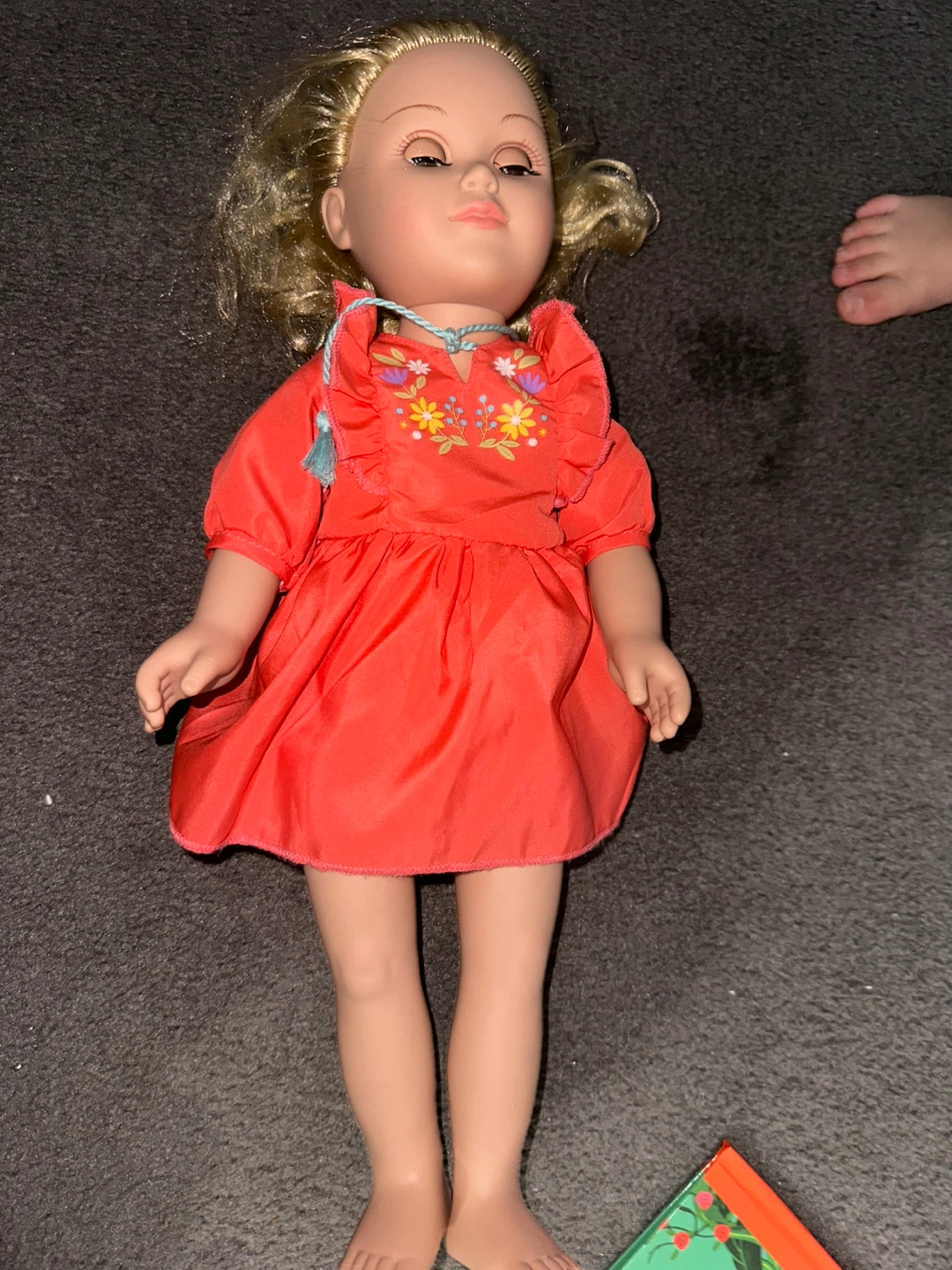 Red doll with embroidered dress