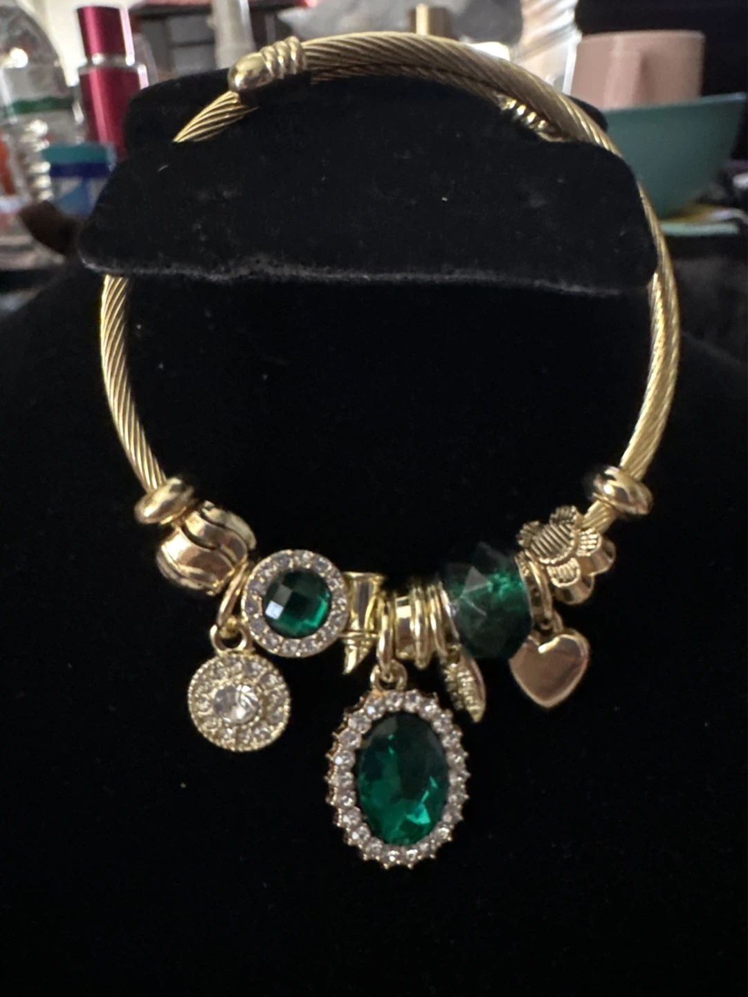 Gold Tone Charm Bracelet with Green Gems