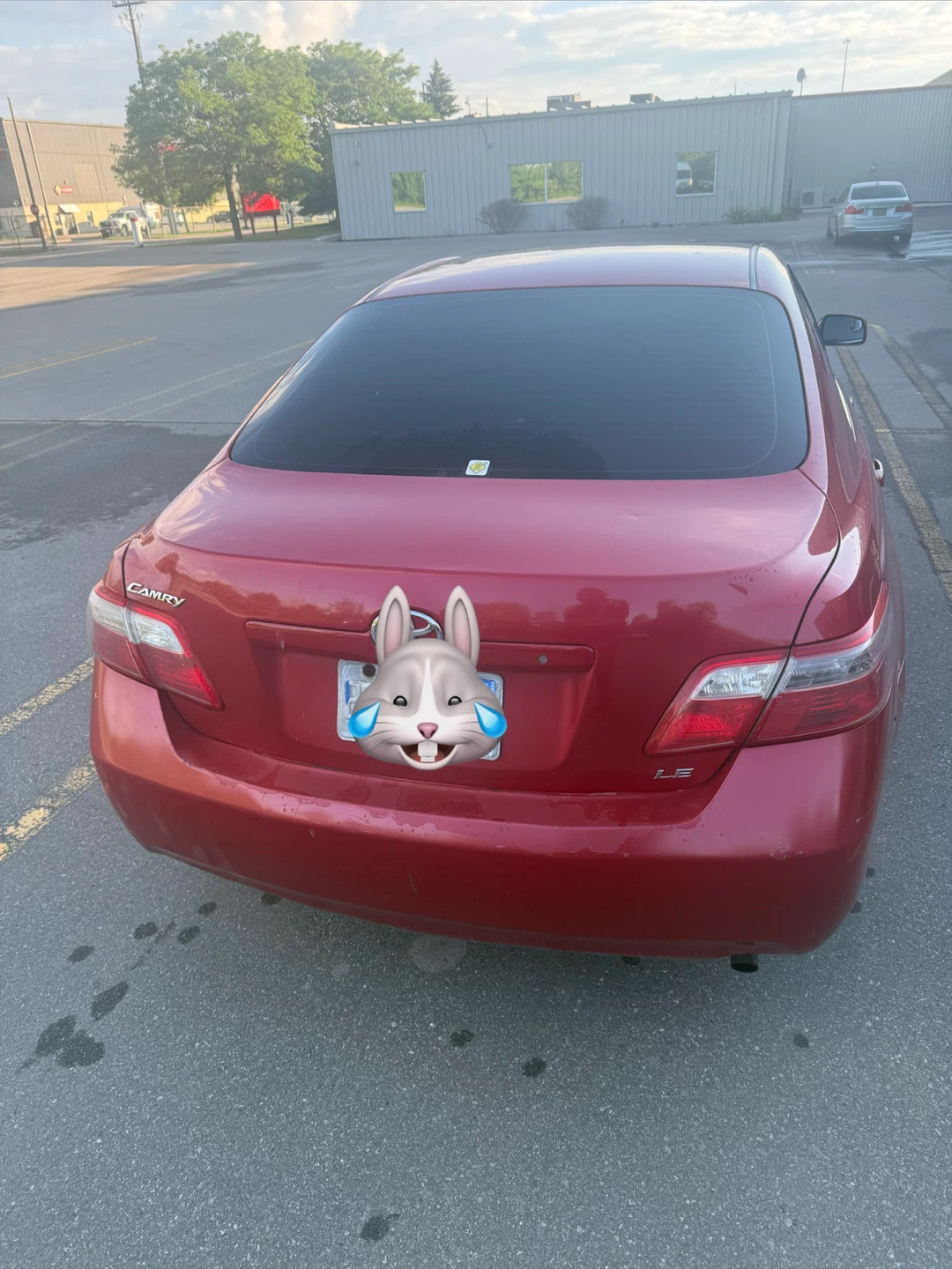 Red Toyota Camry LE Sedan