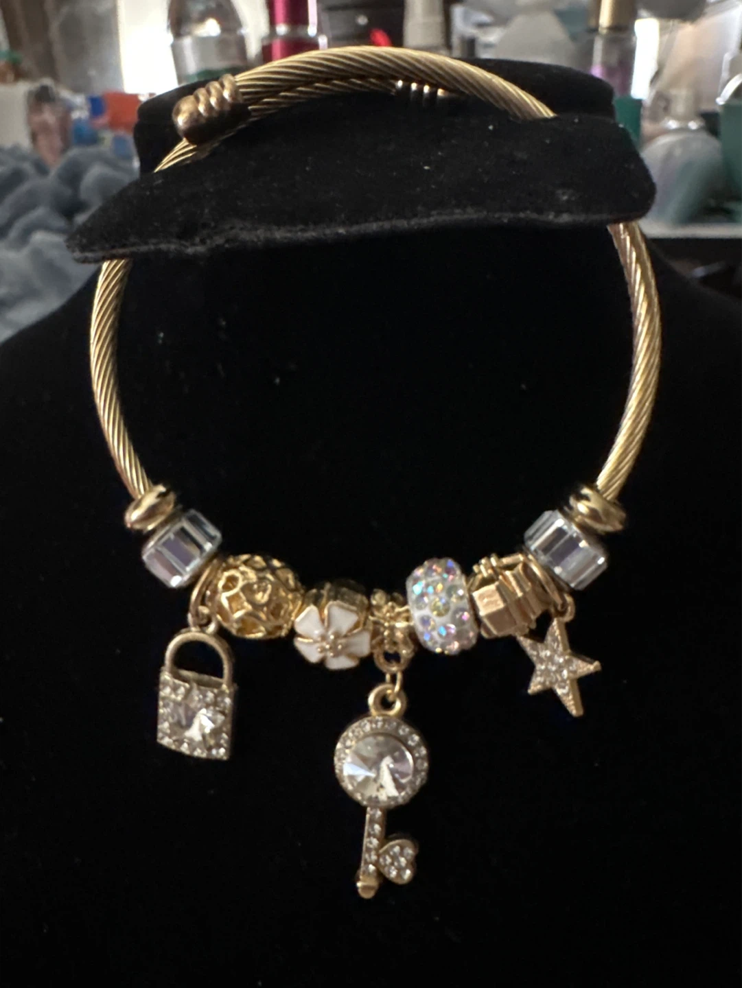 Gold Tone Charm Bracelet with Key, Lock, Star, and Flower
