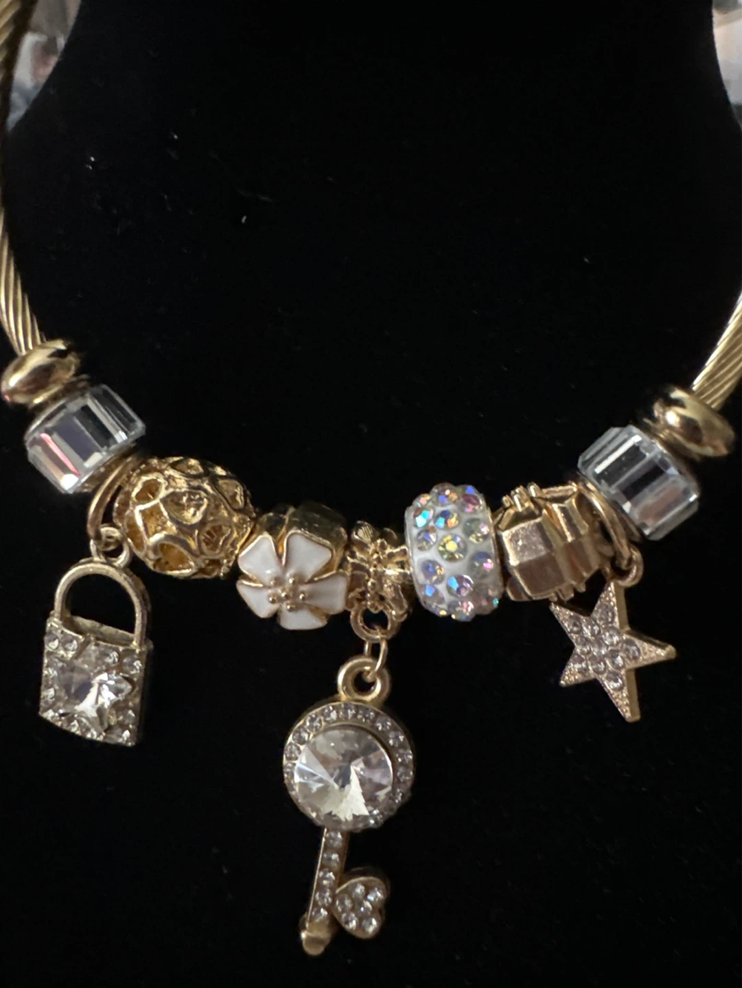 Gold Tone Charm Bracelet with Key, Lock, Star, and Flower - photo 2