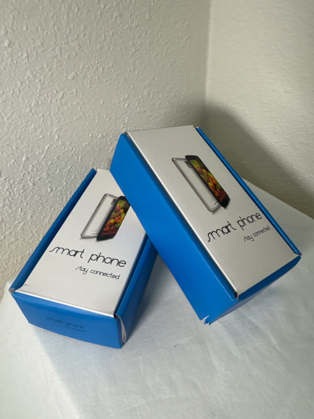 LG Aristo smartphone with charger and box