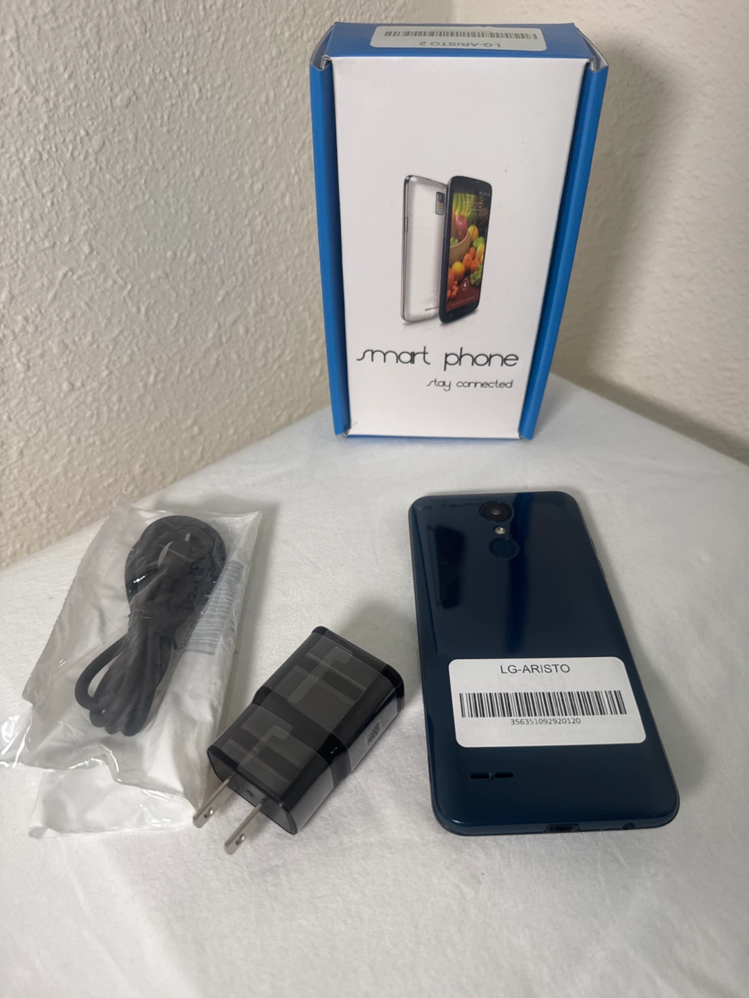 LG Aristo smartphone with charger and box - photo 2