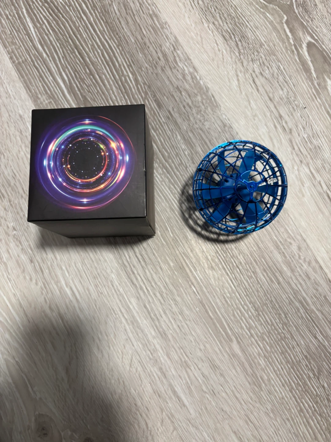 Blue Flying Orb Toy with Charging Cable