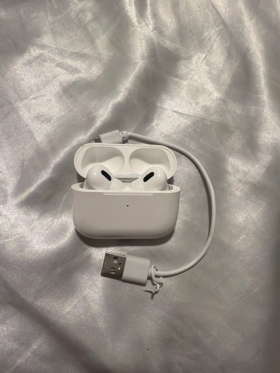 White Wireless Earbuds with Charging Case and Cable