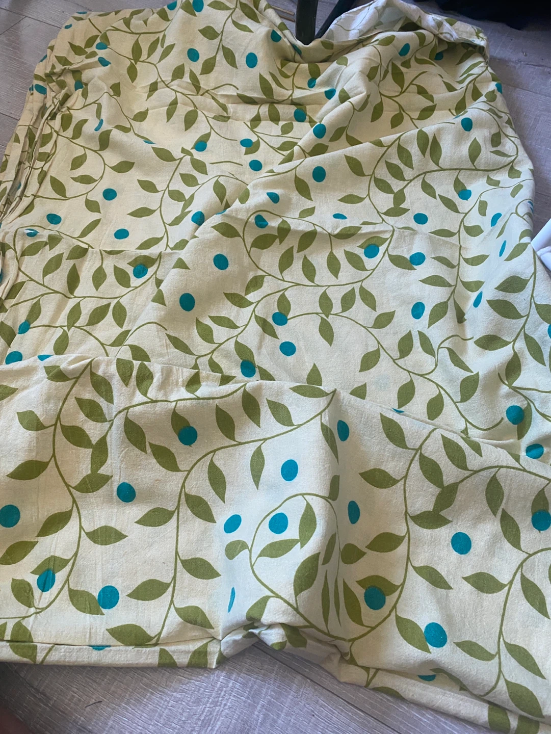 Fabric with Green Leaves and Blue Dots Pattern